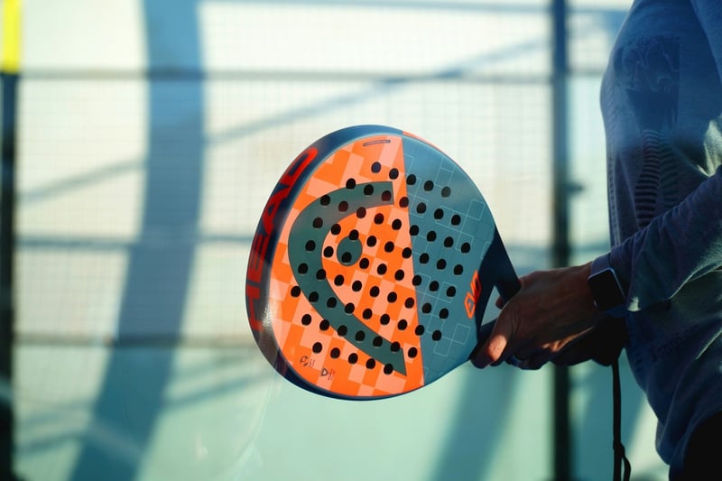 hand holding padel racket 